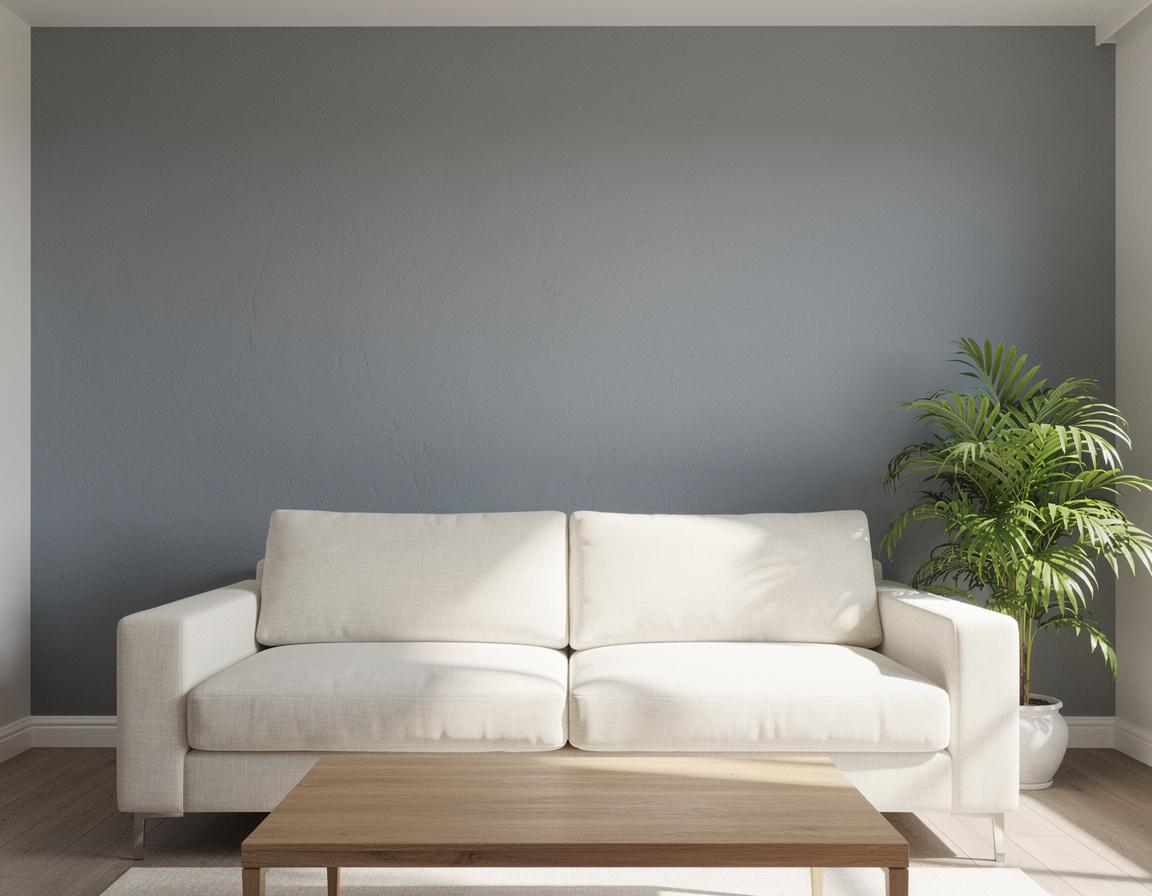 High-quality daylight interior photograph of a modern living room with one prominent cool-gray painted feature wall behind a cream sofa, wooden coffee table, and green plant, realistic wall texture and clean edges, balanced natural window light, no people, no text, no split screen