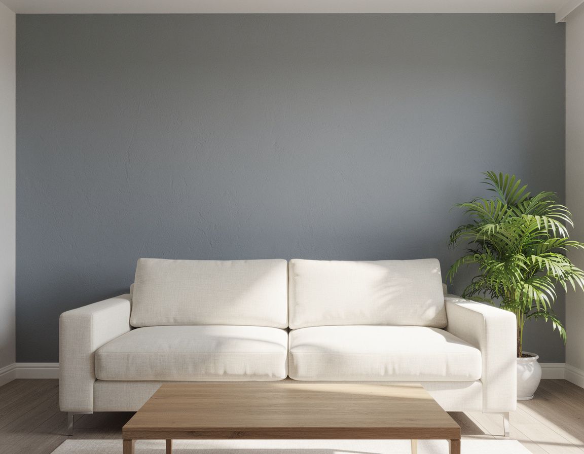 High-quality daylight interior photograph of a modern living room with one prominent cool-gray painted feature wall behind a cream sofa, wooden coffee table, and green plant, realistic wall texture and clean edges, balanced natural window light, no people, no text, no split screen