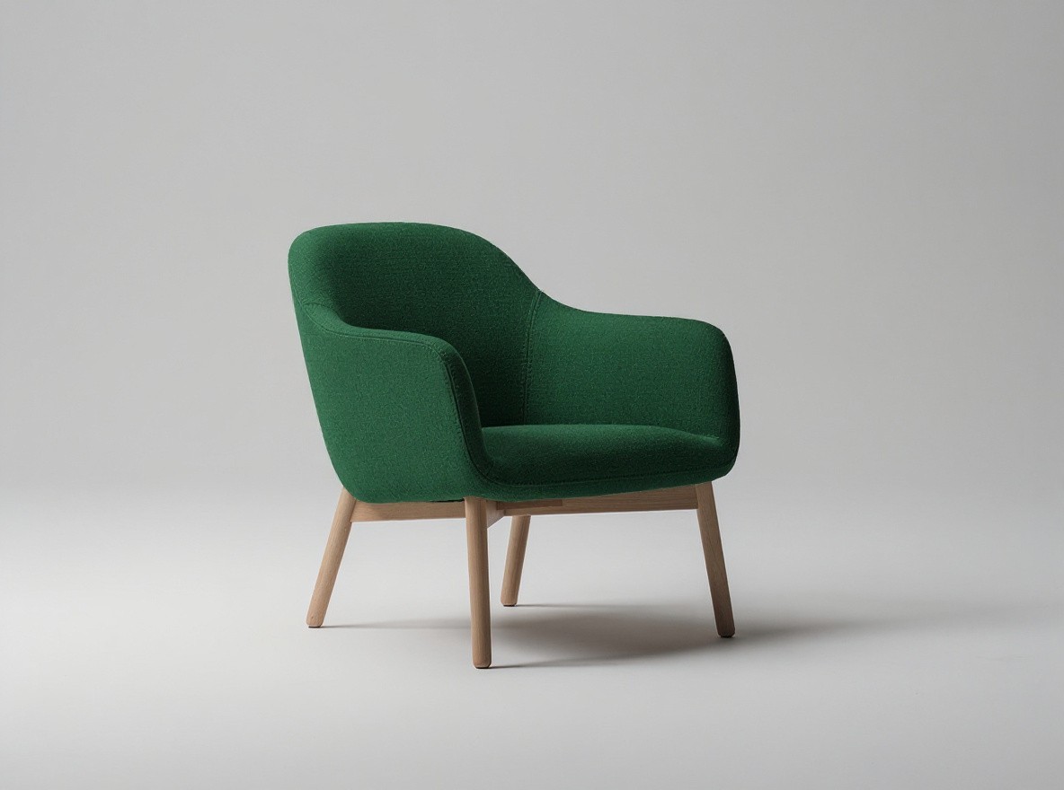 Change only the armchair upholstery color from muted beige to deep forest green. Preserve the exact chair shape, seams, fabric texture, wooden legs, camera angle, framing, background, lighting, and shadows. Do not add or remove anything. No text.